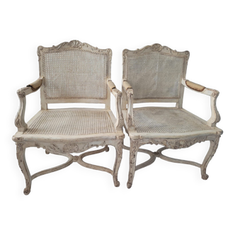 Pair of regency armchairs; canes; white lacquered 19th century