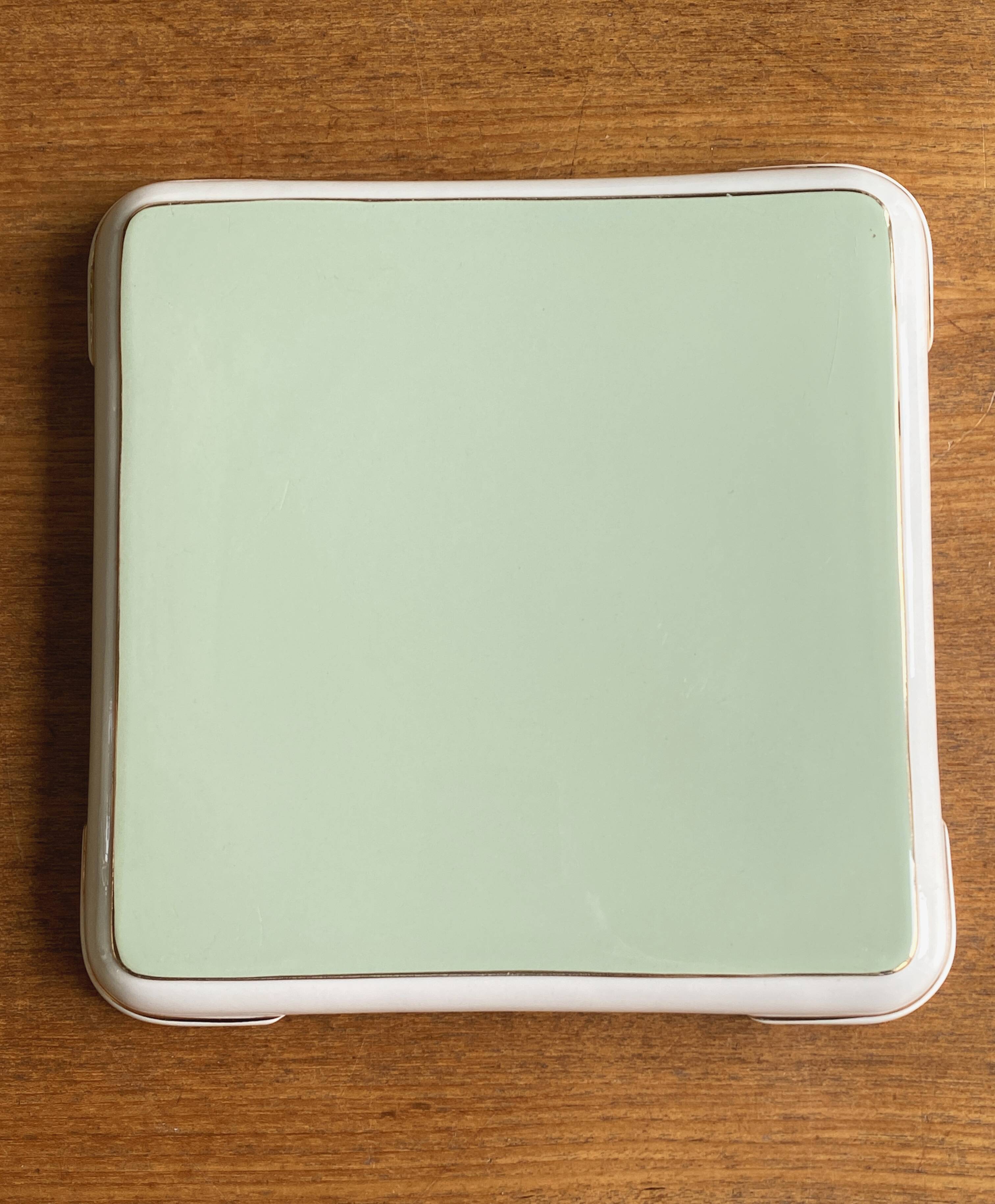 Important vintage trivet in celadon green faience by Villeroy & Boch.