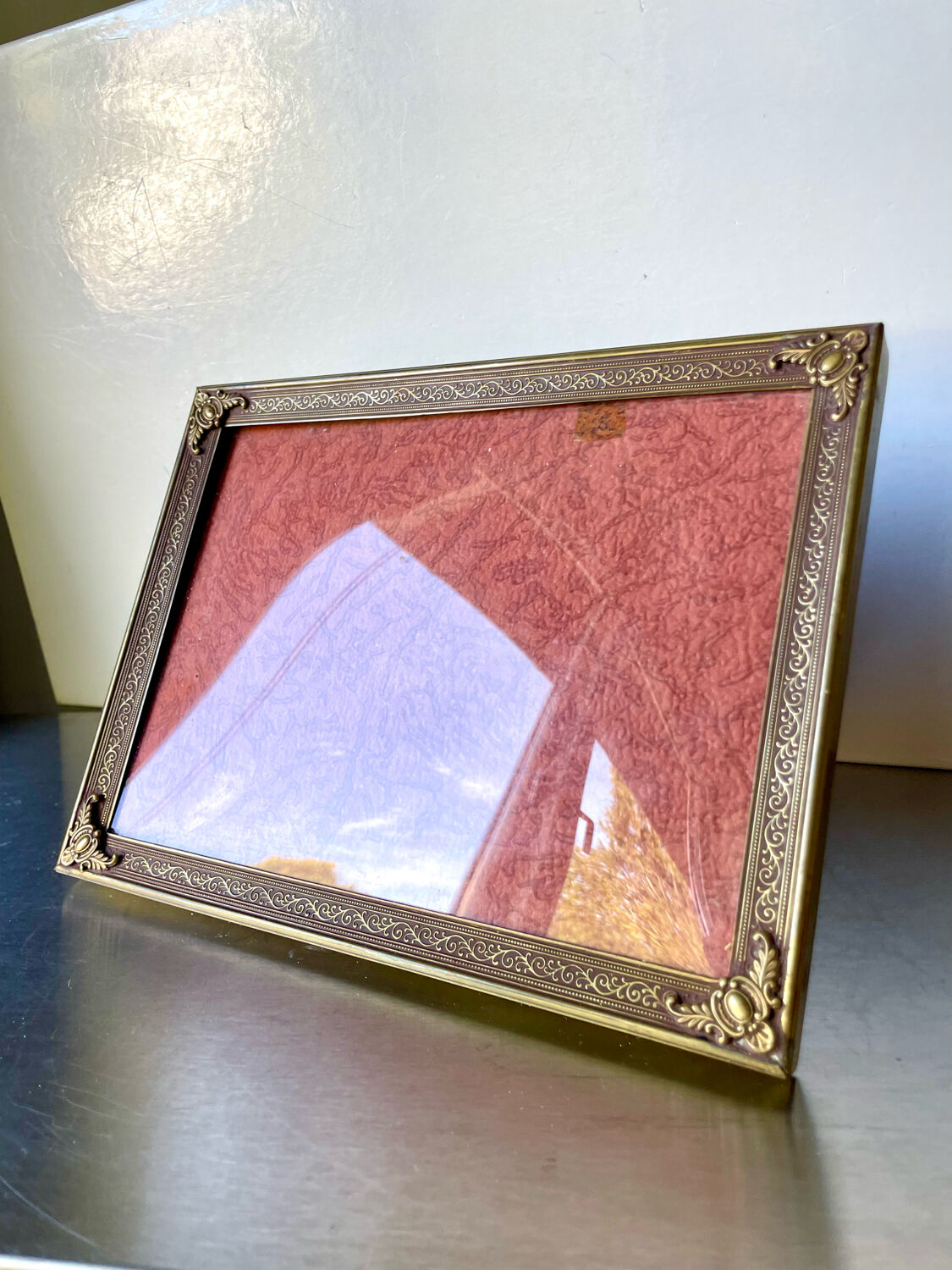 Metal frame in gold colored brass