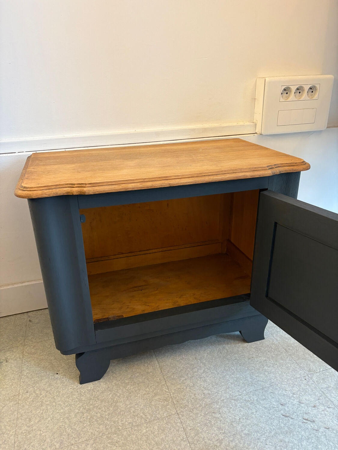 Mat black storage furniture, natural top.