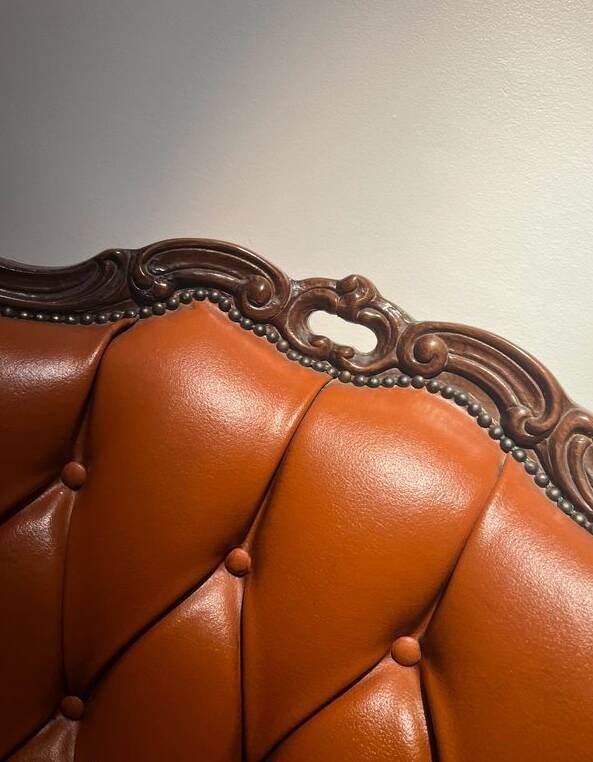 Chesterfield-style leather armchair