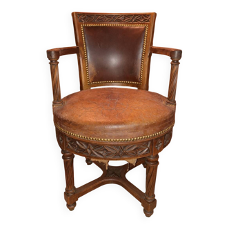 Antique swivel armchair in carved wood and patinated leather – neo-Renaissance style