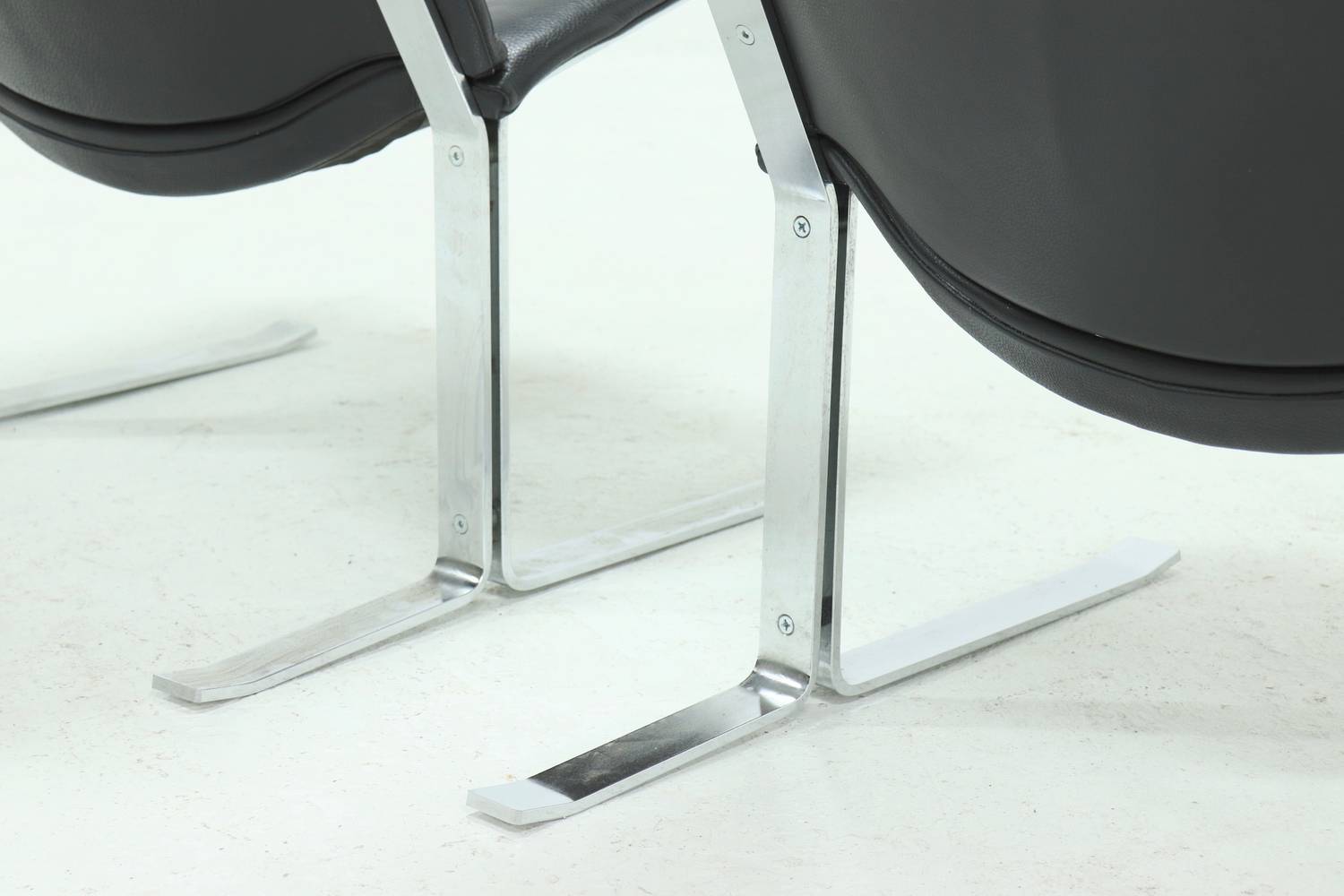 Set of 2 Danish lounge chairs by Kebe Møbler model Eagle with black leather.