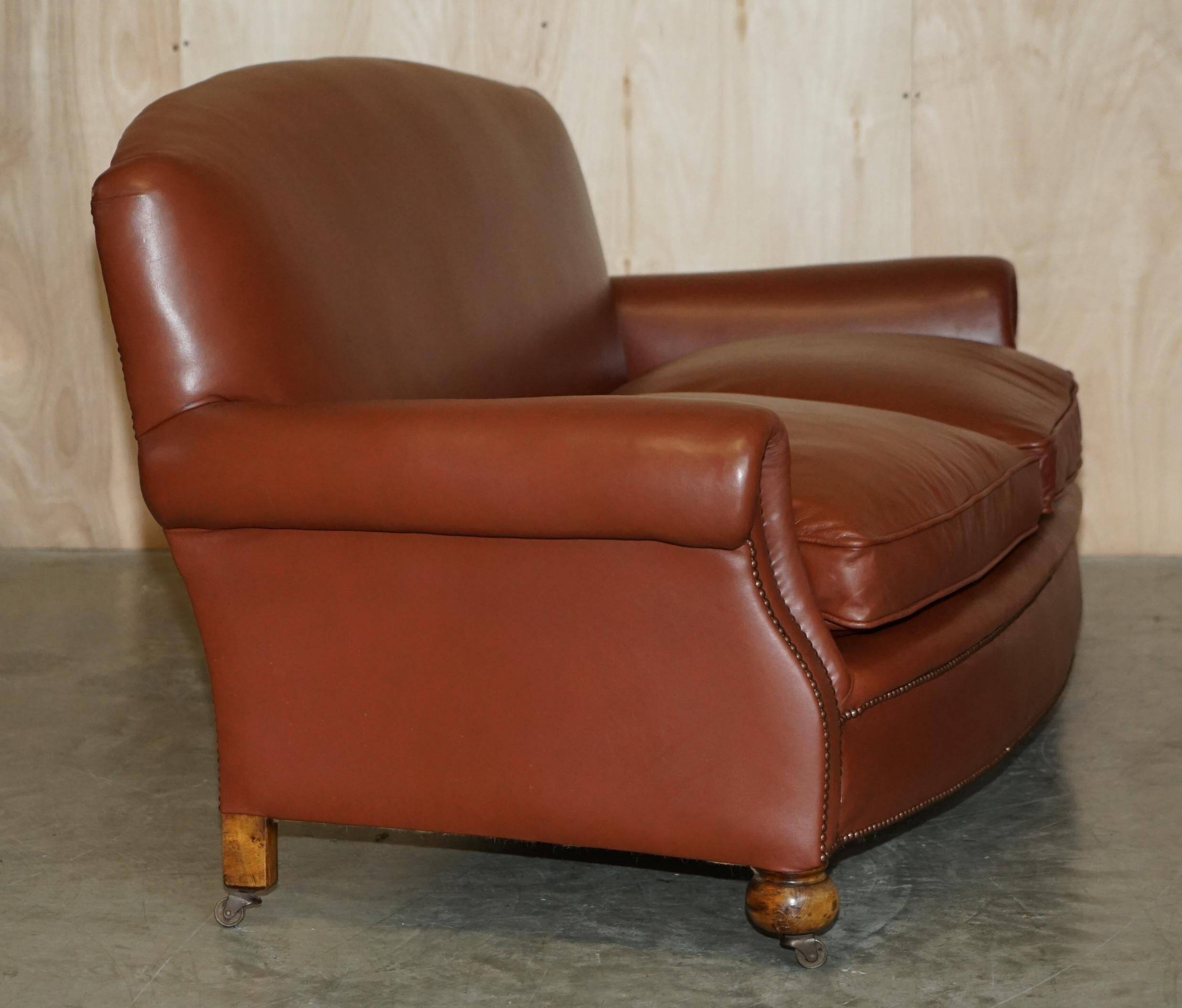 Edwardian leather club canapé circa 1910 with feather cushions.