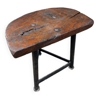 Wooden tripod stool and cast iron structure