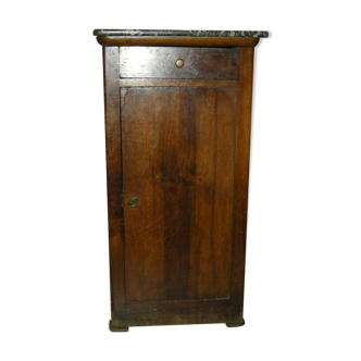 Walnut bedside table on marble