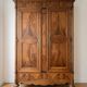 Large antique wooden wardrobe with drawer.