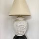 1980s ceramic table lamp with a wooden base and adjustable shade.