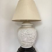 1980s ceramic table lamp with a wooden base and adjustable shade.