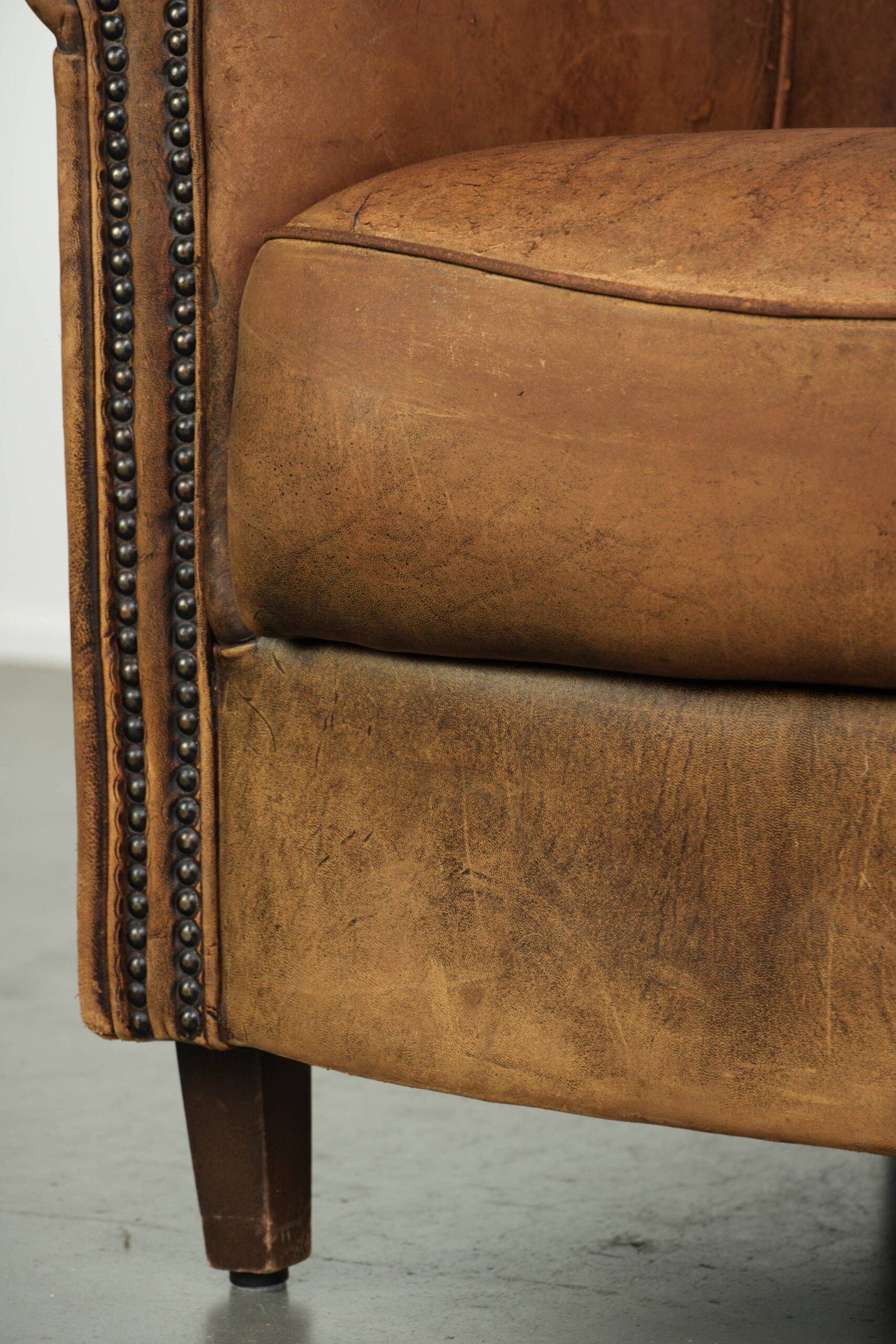 Vintage sheepskin clubchair in a beautiful cognac colour with a sturdy look