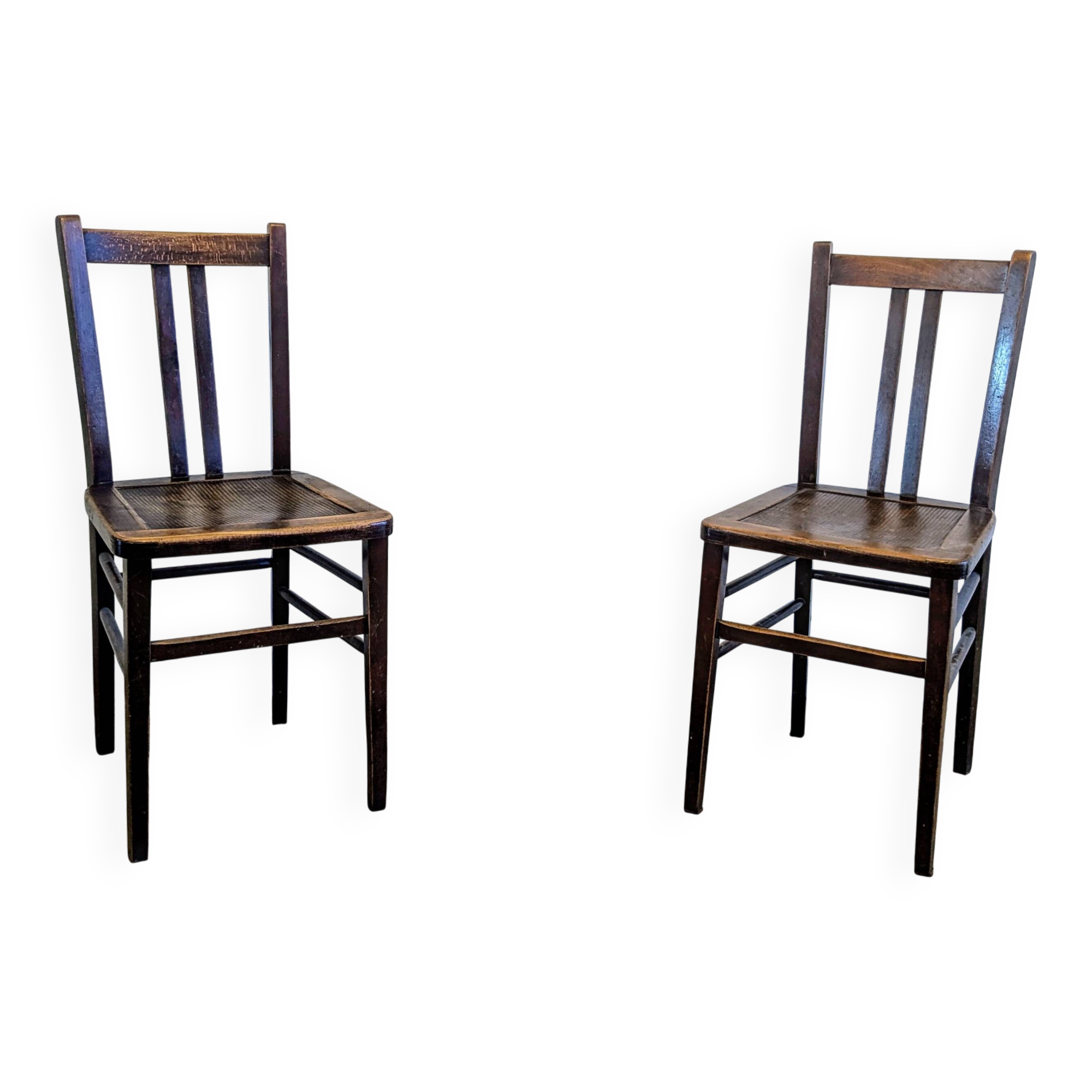 Pair of 1930s bistro chairs with patinated wood.