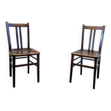 Pair of 1930s bistro chairs with patinated wood.
