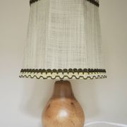 Turned wooden lamp with linen shade