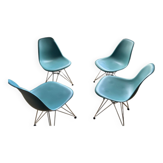 4 Eames chairs in turquoise blue color