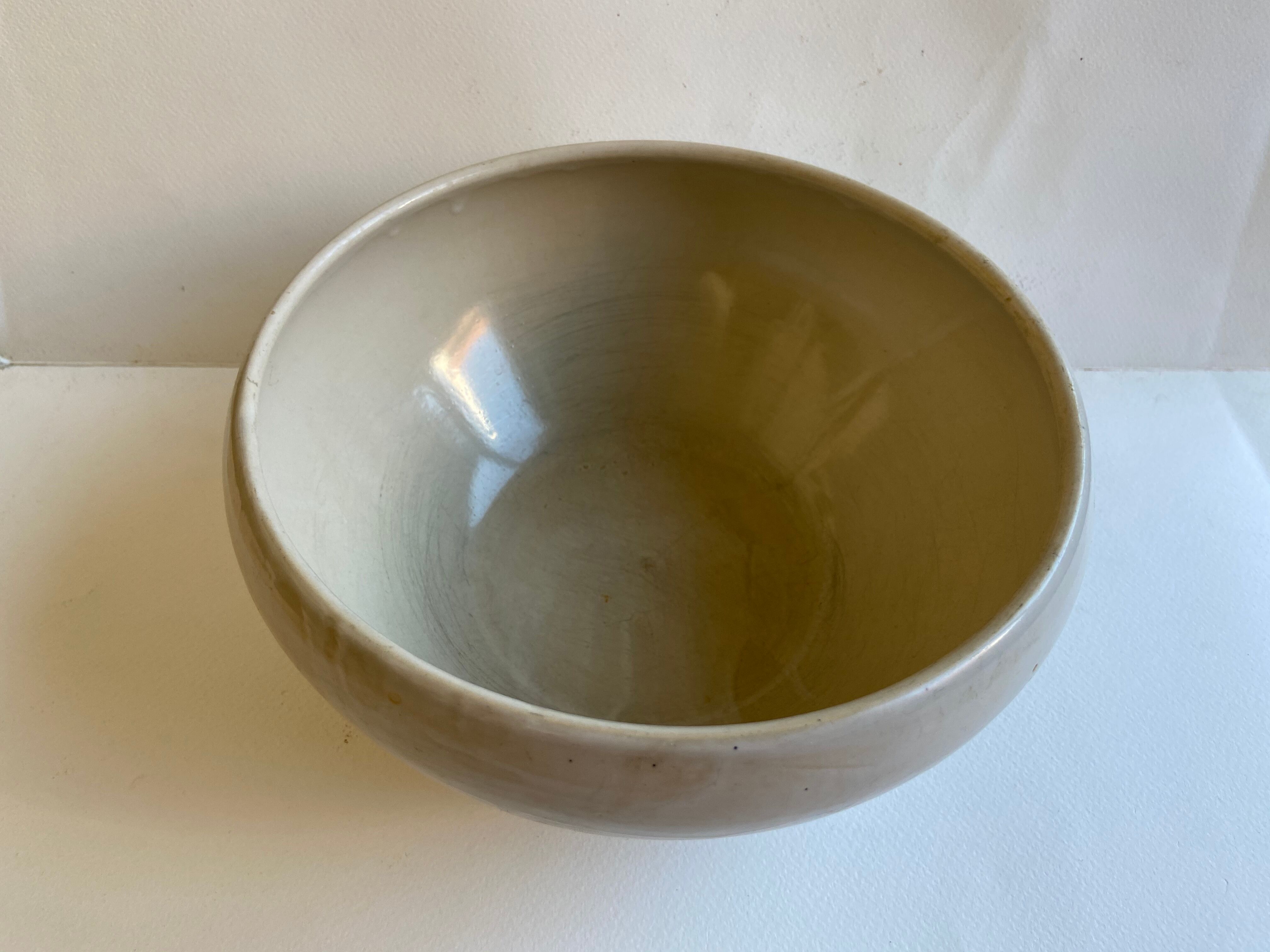 Pair of enamelled sandstone bowls