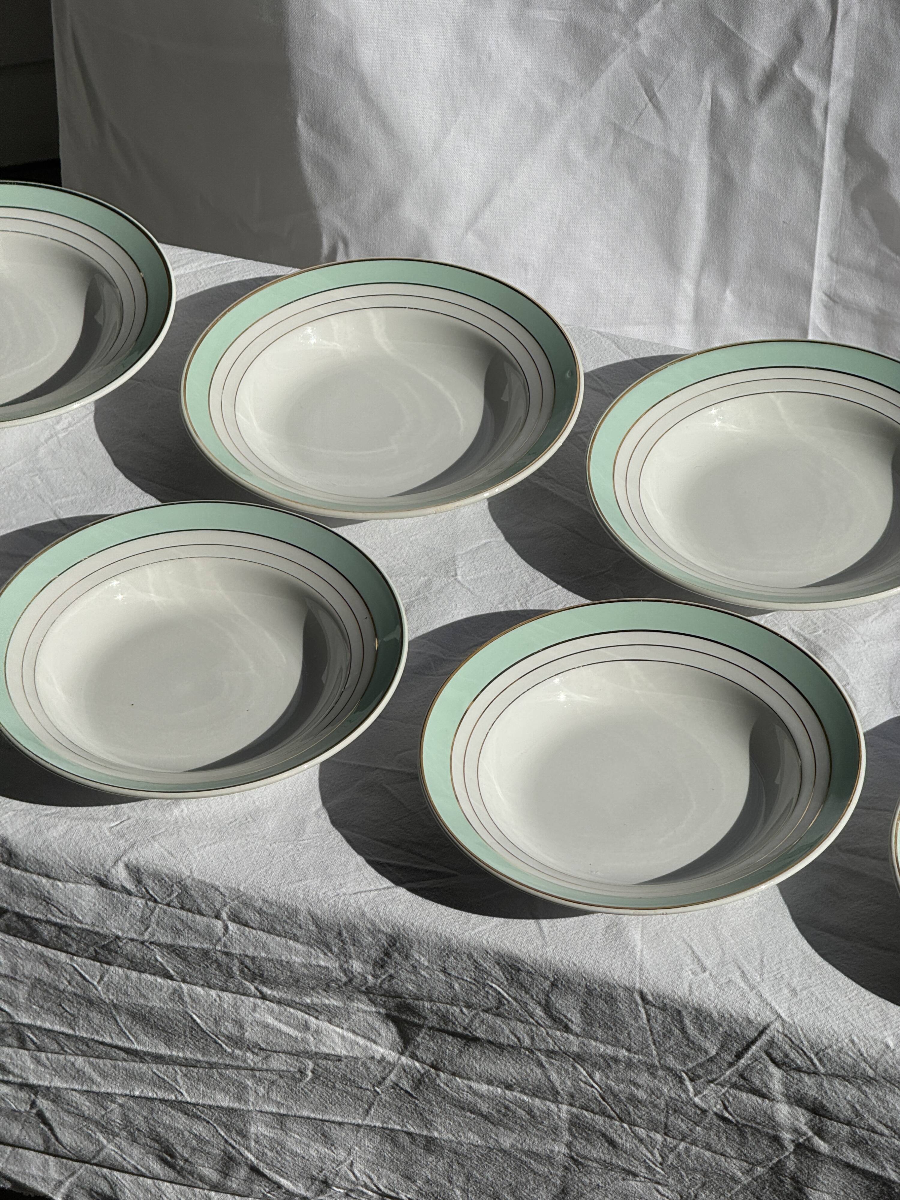 Set of 8 antique turquoise deep plates with a gold rim D22.5