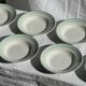 Set of 8 antique turquoise deep plates with a gold rim D22.5