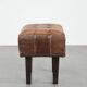 Beautiful sheepskin ottoman on high legs and beautiful warm colours