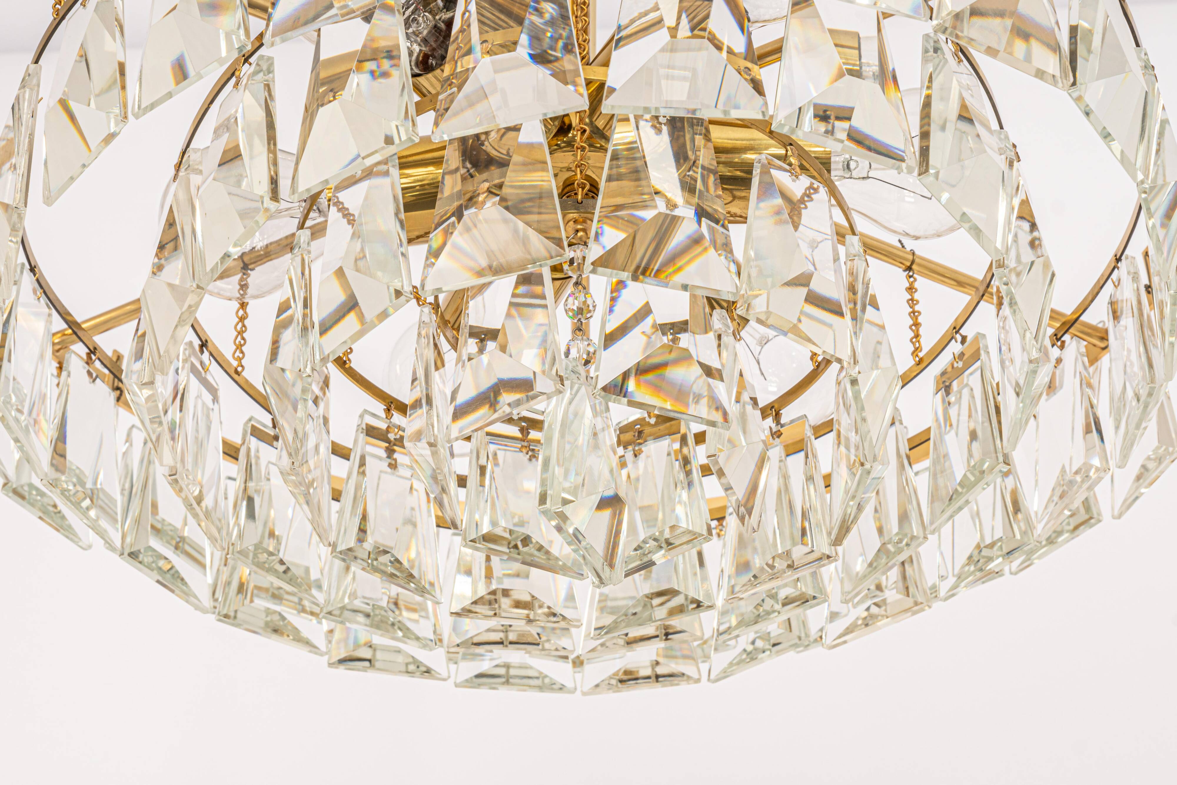 Large chandelier in gilded brass and crystal, by Palwa, Germany, 1970s.