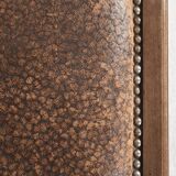 Art Deco style chair in carved wood and leather.