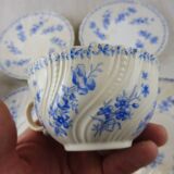 Lot of porcelain cups and under cups, twisted decoration, from Sarreguemines