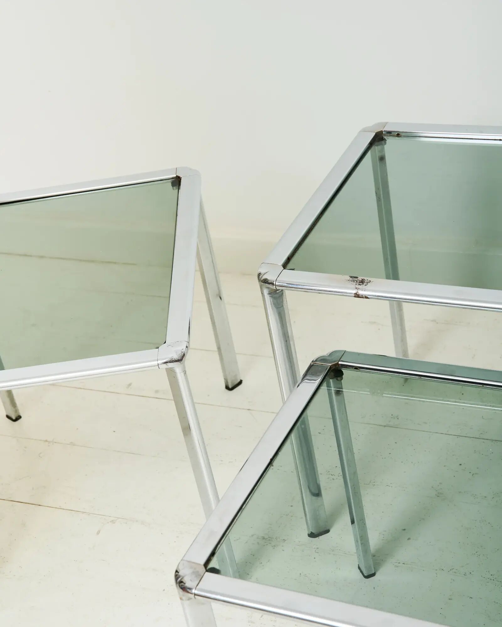 Nest tables in chrome and smoked glass, Italy, 1970s.