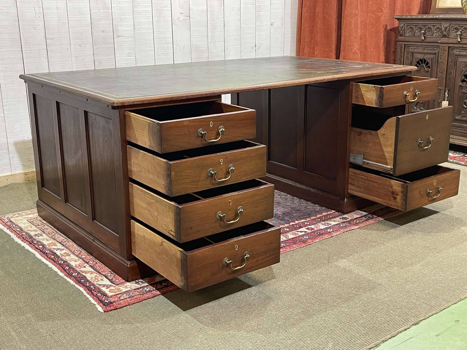 Large English flat desk in mahogany with leather top, early 20th century