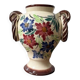 Ceramic vase with hand-painted floral decoration.