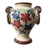 Ceramic vase with hand-painted floral decoration.