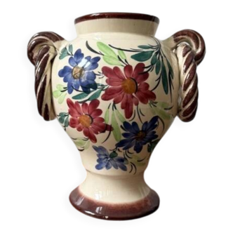 Ceramic vase with hand-painted floral decoration.