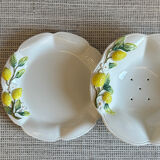 Plate and colander of lemons in slipware