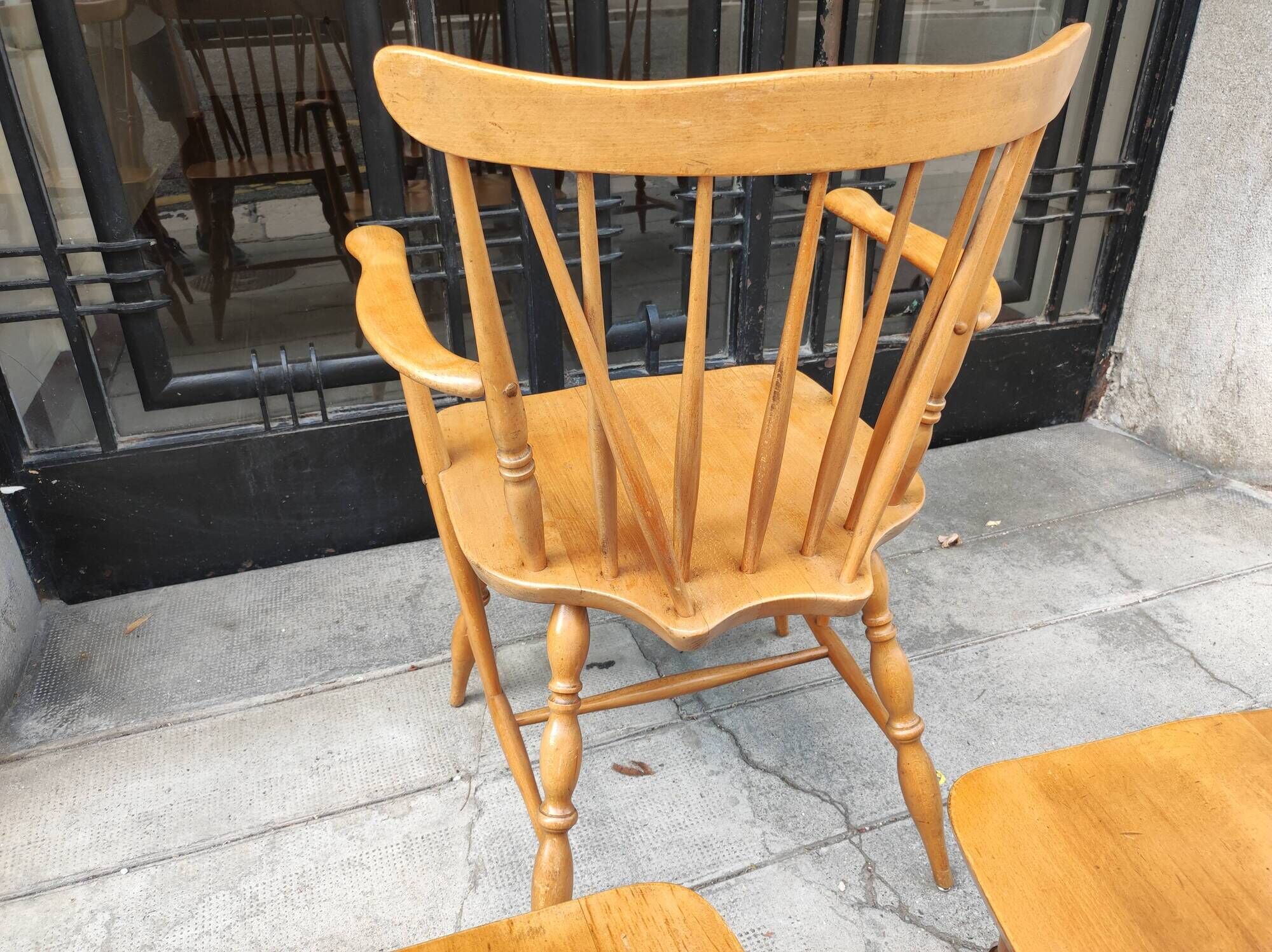 Four chairs and a Heywood Wakefield Windsor armchair. Vintage