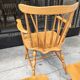Four chairs and a Heywood Wakefield Windsor armchair. Vintage