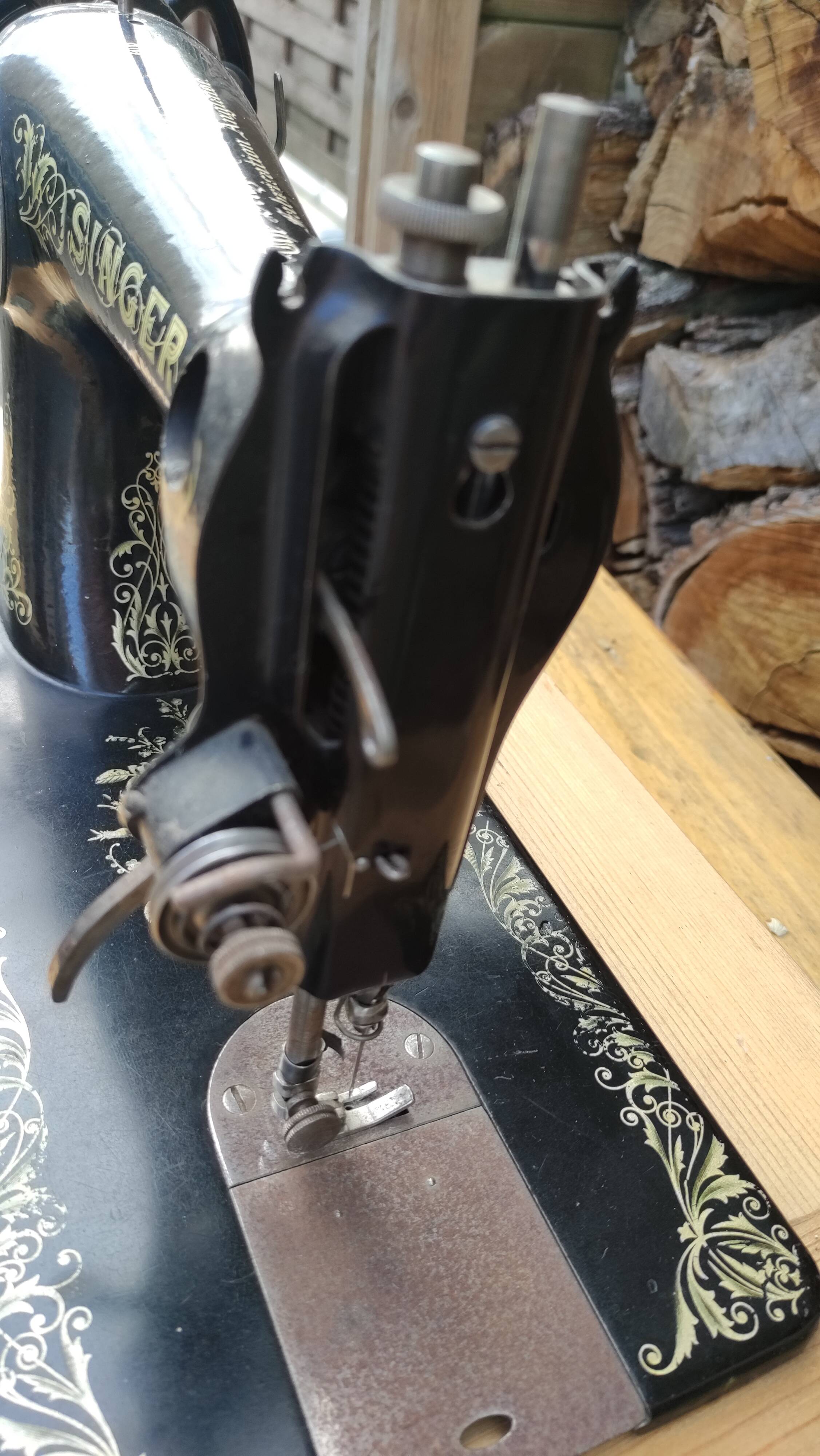 Old Singer sewing machine on pedestal