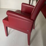 RED LEATHER ARMCHAIRS signed “SEDE”