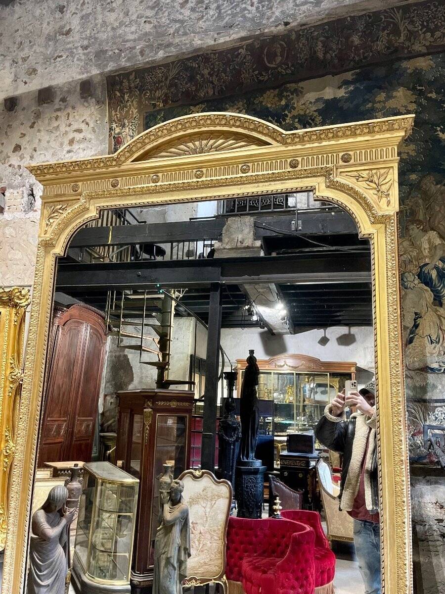 Louis XVI style gilded wood mirror from the Napoleonic III era, 2.75m x 1.48m.