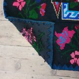 Handwoven floral wool rug, black background with pink roses and geometric design 207x144cm