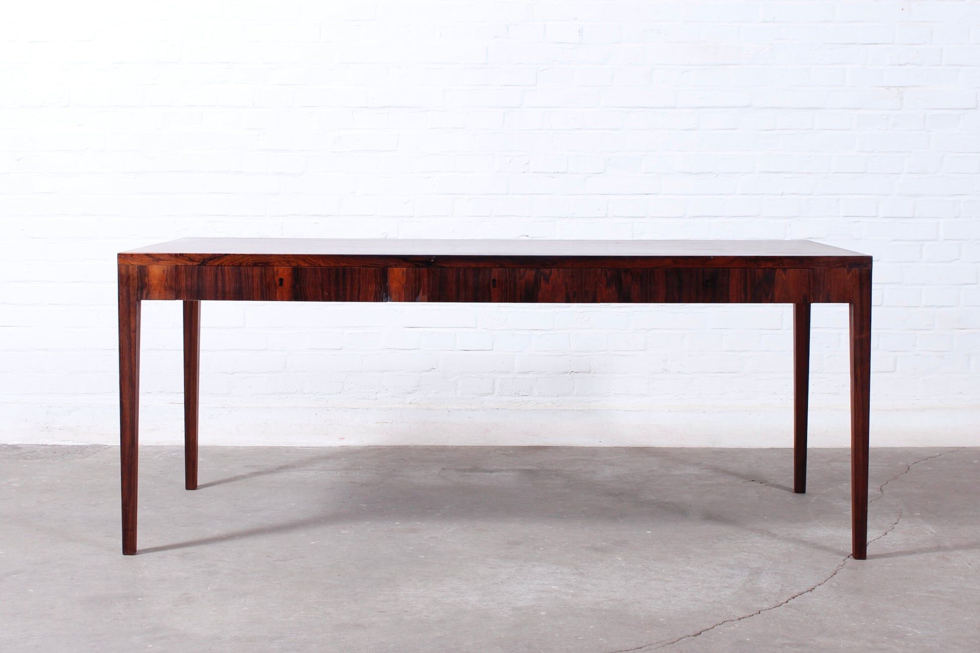Minimalist rosewood desk by Riis Andersen