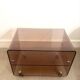 Coffee table / serving table in smoked plexiglass by Michel Dumas