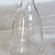 Vintage glass carafe with embossed bee motifs