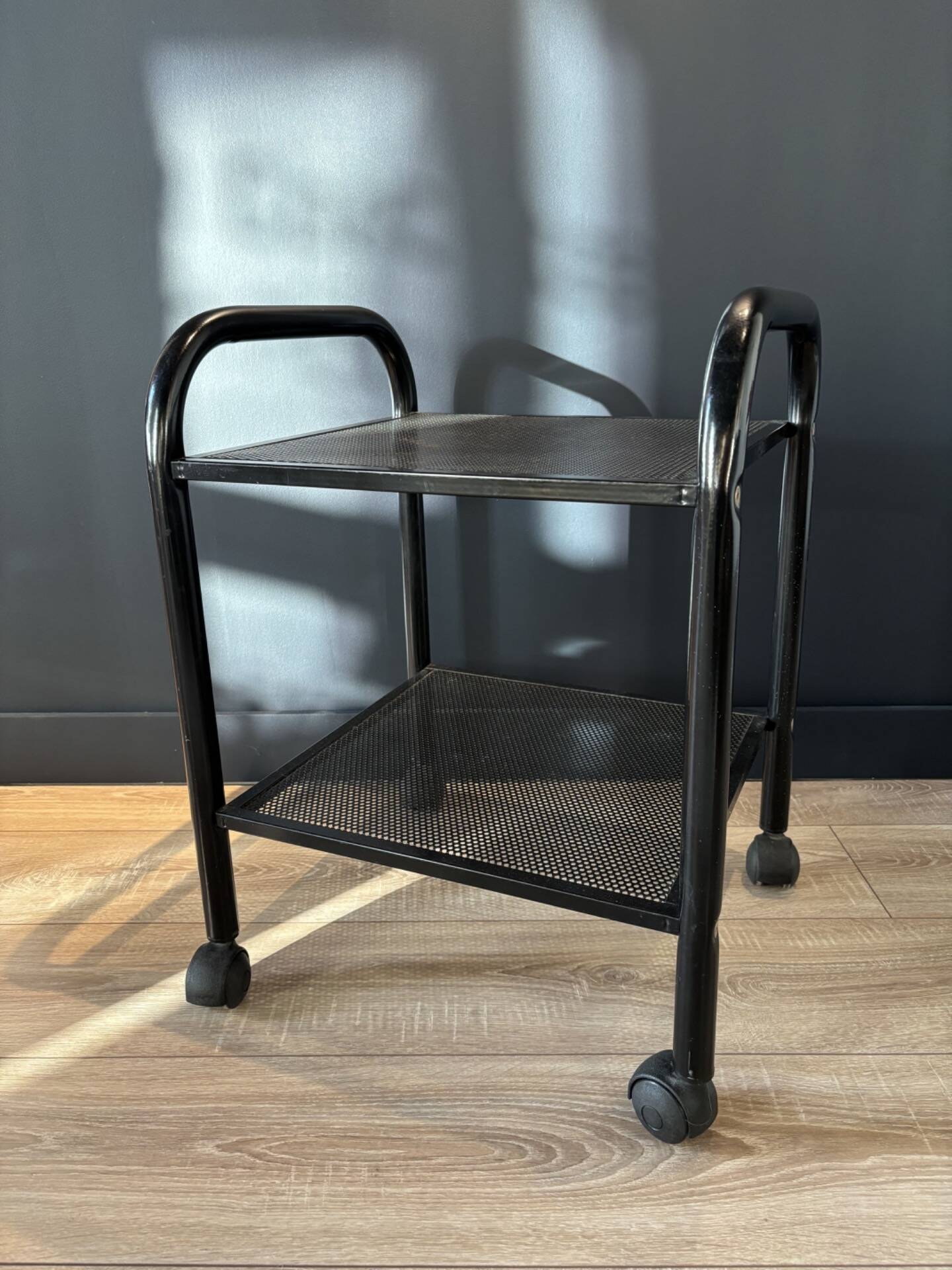 Vintage black metal rolling dessert trolley