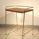 Side table - wooden and gold metal magazine rack