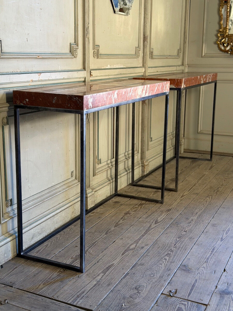 Pair of contemporary consoles in marble and metal.