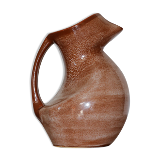 Brown painted earthenware pitcher