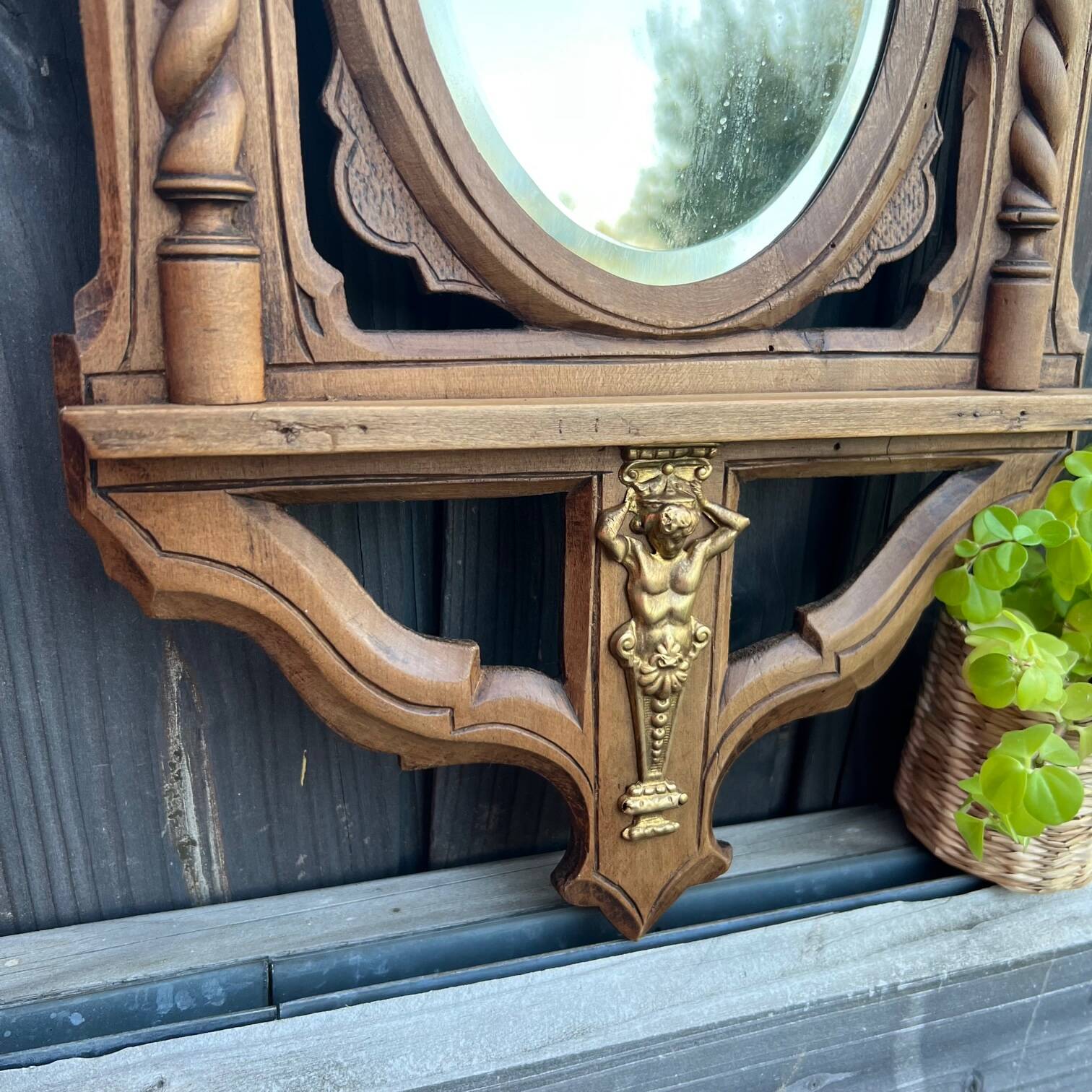 Antique “dragons” mirror in carved wood