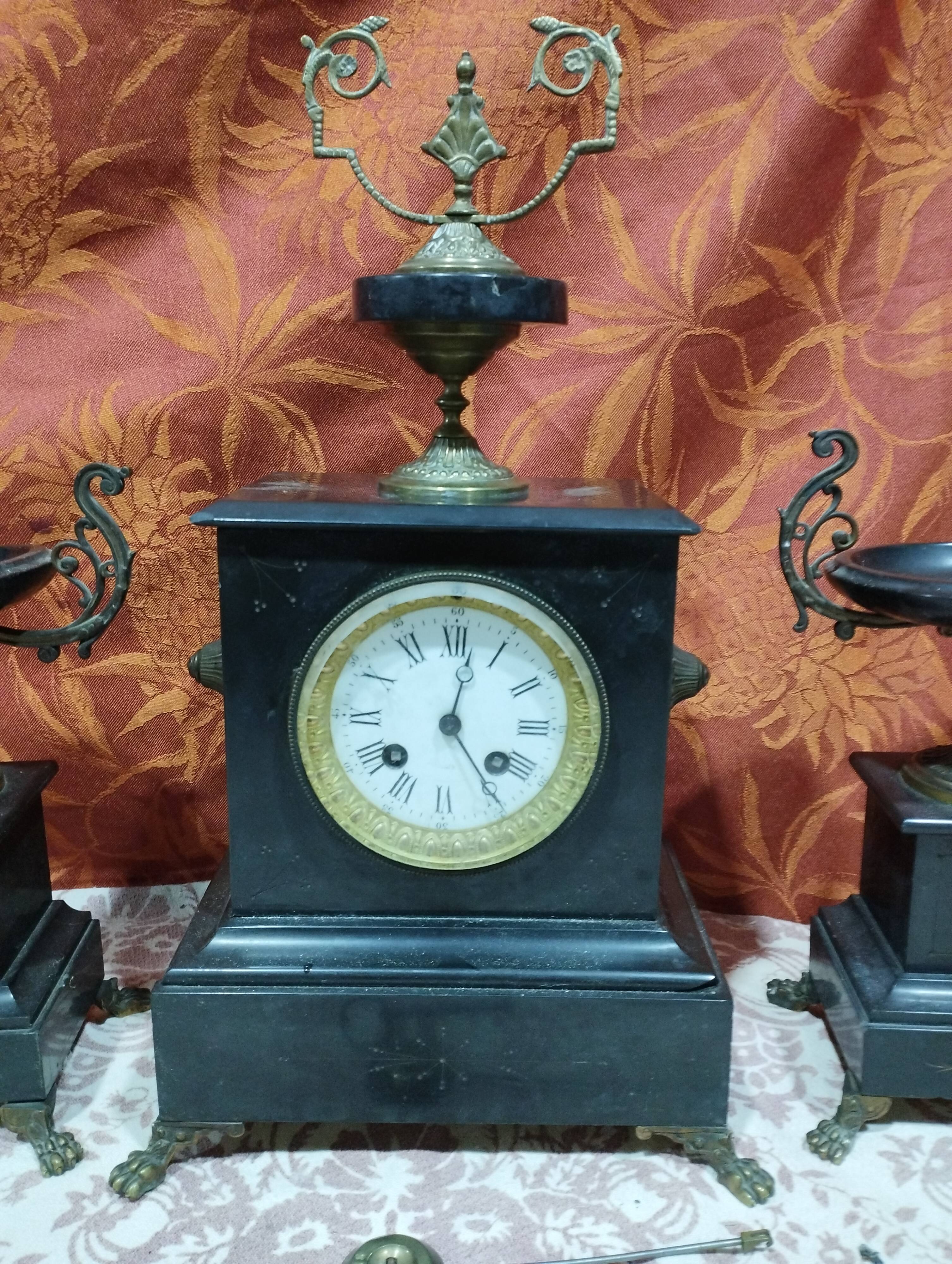 old Napoleon III marble fireplace surround with cups and pendulum