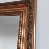 Miroir bois sculpté patine doré
