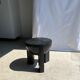 Black mango wood tripod side table with a semi-spherical top, height: 45 cm, diameter: 44 cm.
