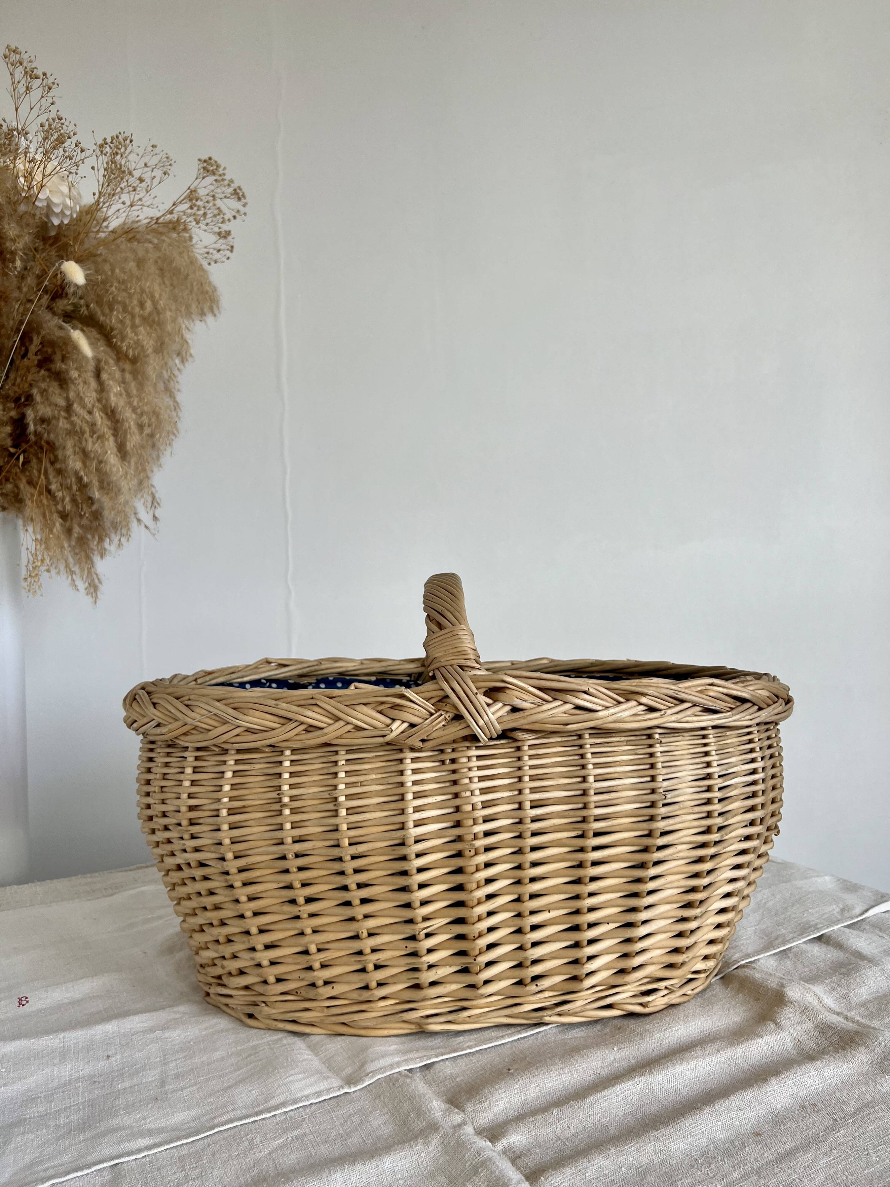 Large vintage wicker basket and blue lining with white polka dots