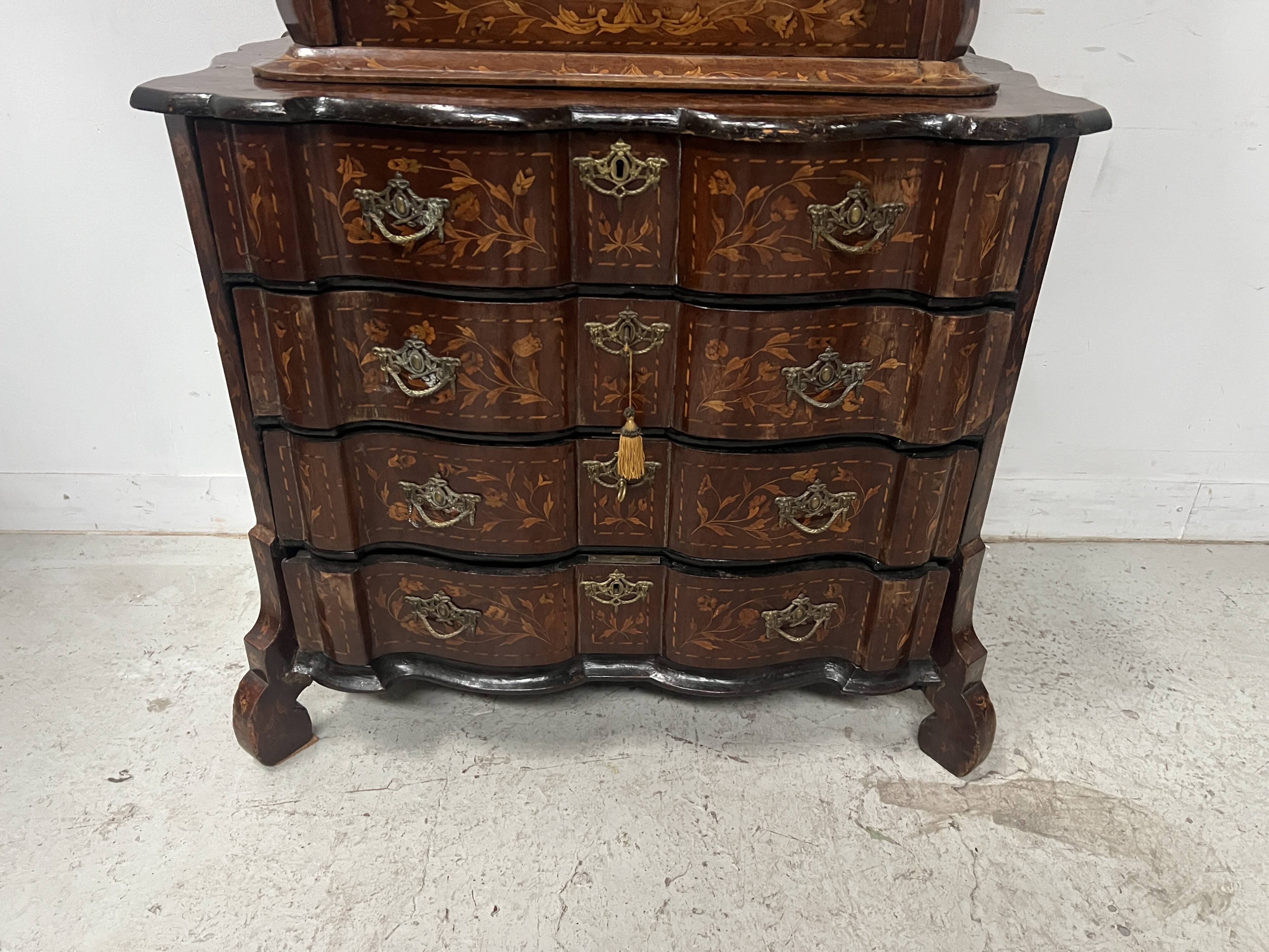Dutch display cabinet in two parts made of marquetry wood.